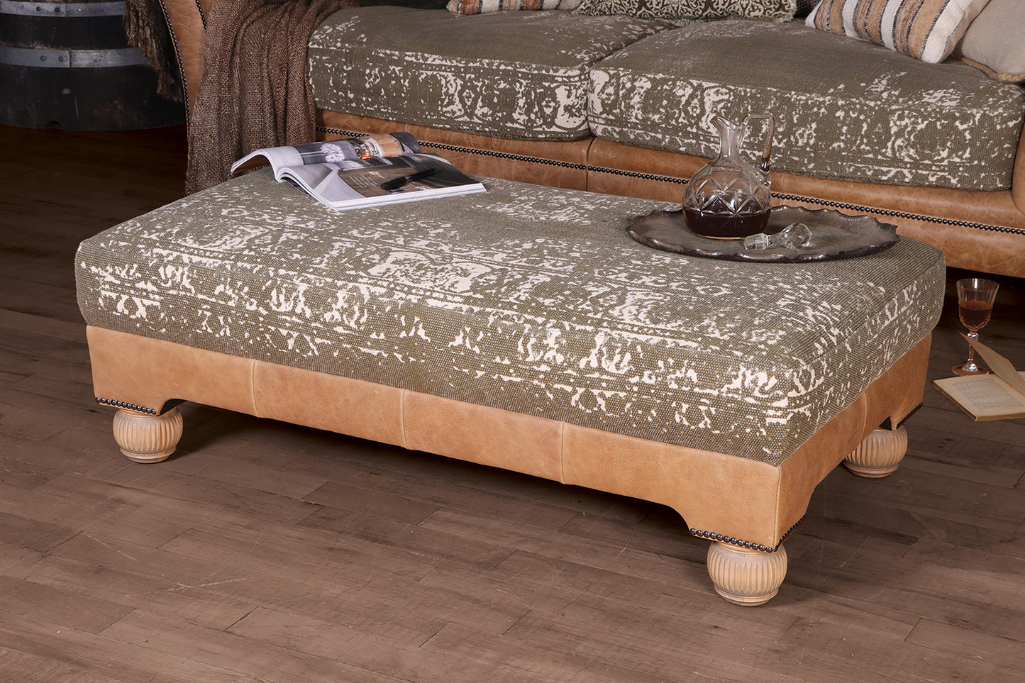 Tetrad Montana Stool in Atacama Nutmeg Tan Leather with a cream and khaki colour upholstery, beautiful stud detailing and Bun feet