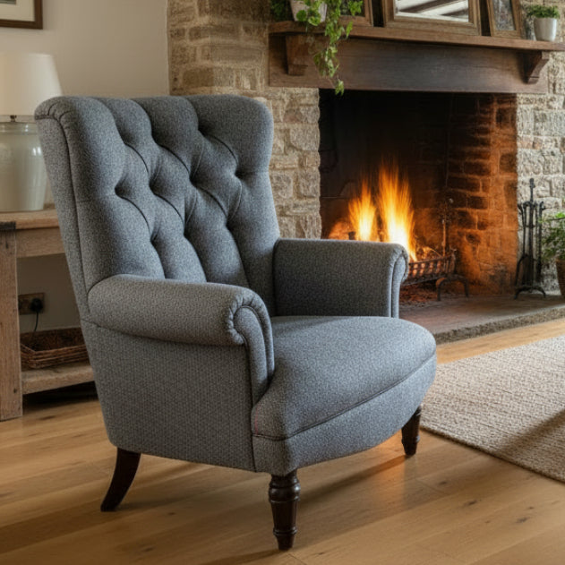 Tetrad Regent Armchair handcrafted in Basalt Herringbone tweed with Old Bard Piping, generously padded rolled armrests and dark wood legs