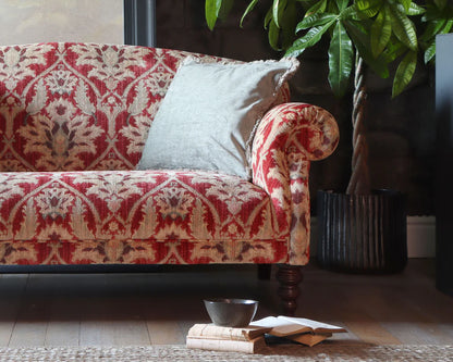 Tetrad Tallis Grand Sofa in Enigma Claret luxurious damask upholstery in deep claret ed with cream scatter cushions, elegant scrolled arms and dark wood legs
