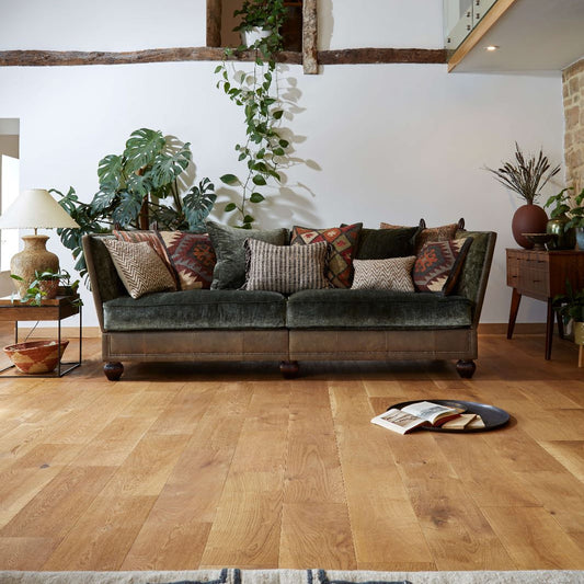 Tetrad Warwick Grand Sofa in Coco Velvet Olive Fabric and Comanche Timber Leather shown complete in a furnished room.