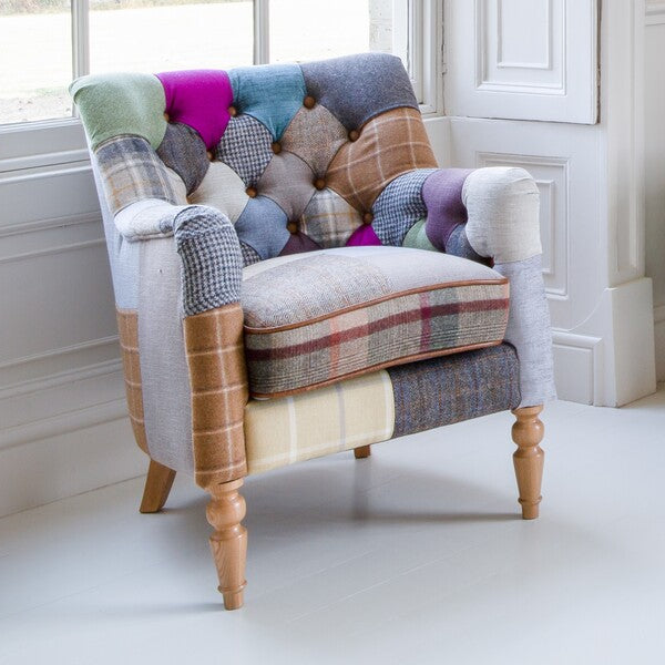 Vintage Sofa Company Alsace Petit Patchwork Chair in a room setting showing the buttoned back, colourful patchwork upholstery and turned wooden legs
