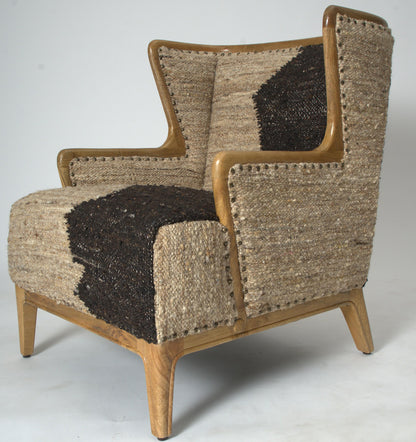 Vintage Sofa Company Ballari Accent Chair features cream and charcoal upholstery in a boucle style, with brass stud detail and an exposed wooden frame