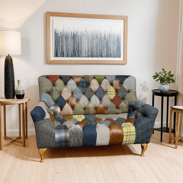 Vintage Sofa Company Bamford Club 2 Seater Sofa Upholstered in Patchwork Fabric with deep diamond button tufting and turned wooden legs