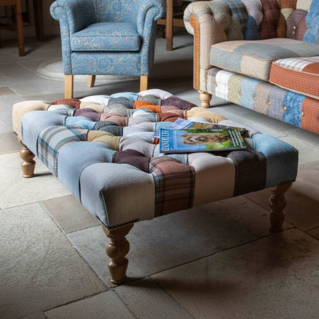 Vintage Sofa Company Banquet Large Footstool Upholstered in a Fabric Patchwork with deep button tufting, brass stud detailing and turned wooden feet