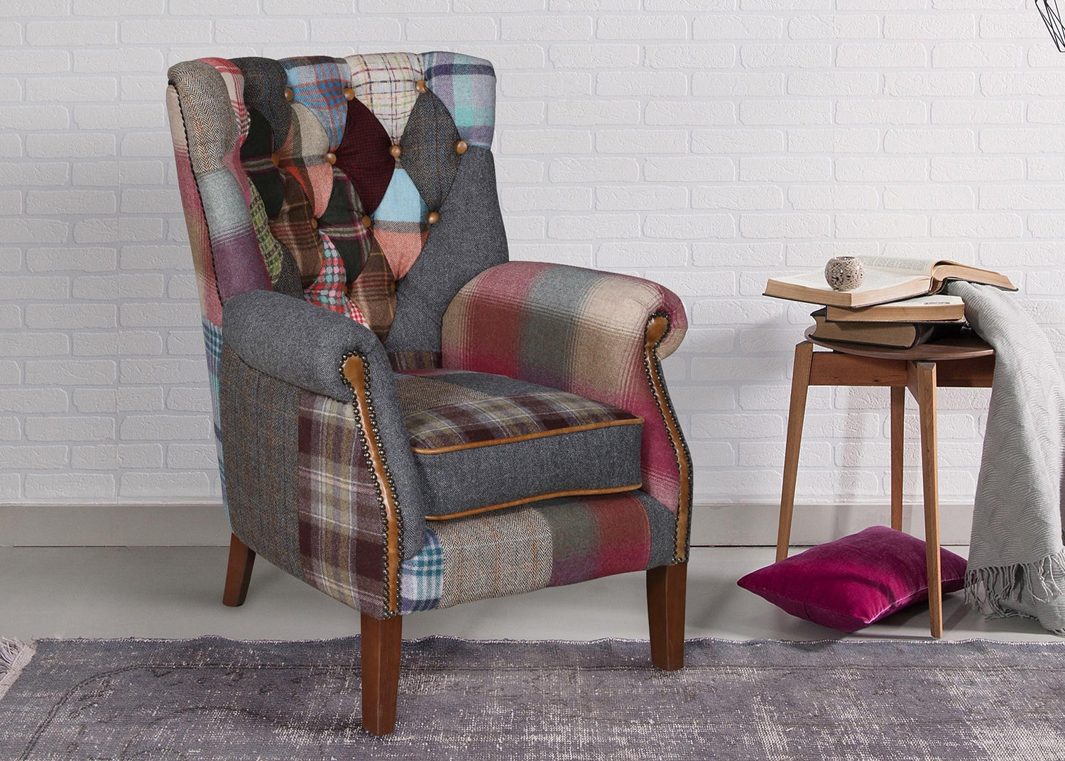 Vintage Sofa Company Barnard Patchwork Chair features deep button tufting, scrolled arms, brass stud detailing and a seat cushion with tan leather piping