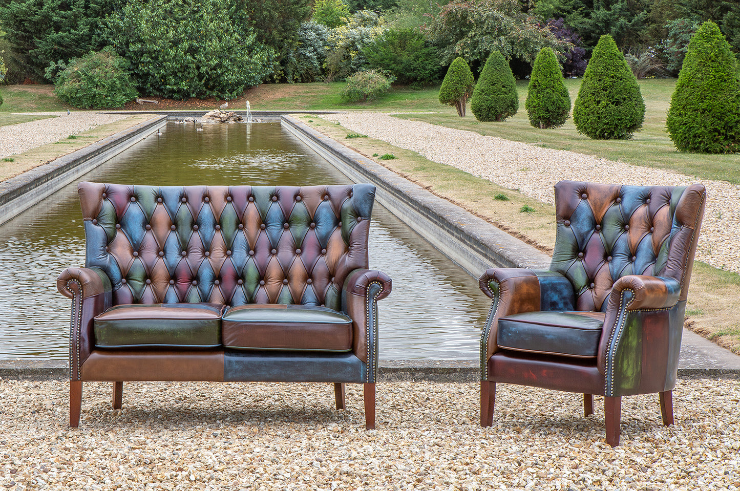 Vintage Sofa Company Bowes Rub-Off Leather Patchwork 2 Seater Sofa features deep button tufting with the high backrest, scrolled arms and brass stud detailing
