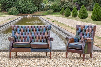 Vintage Sofa Company Bowes Rub-Off Leather Patchwork 2 Seater Sofa features deep button tufting with the high backrest, scrolled arms and brass stud detailing