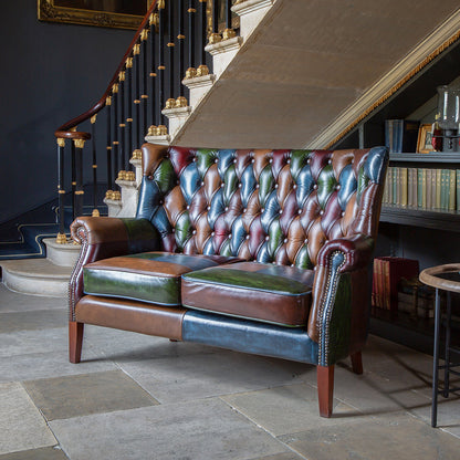 Vintage Sofa Company Bowes Sofa is a distinctive leather patchwork two seater with classic buttoned detailing. The rub-off leather finish gives each panel added depth, while the high back and supportive seat keep it practical as well as eye-catching.