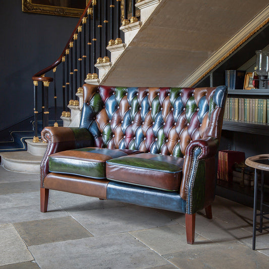 Vintage Sofa Company Bowes Sofa is a distinctive leather patchwork two seater with classic buttoned detailing. The rub-off leather finish gives each panel added depth, while the high back and supportive seat keep it practical as well as eye-catching.