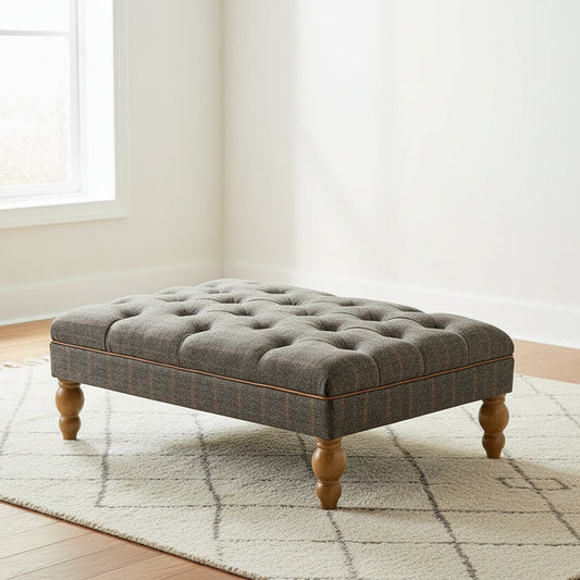 Vintage Sofa Company Buttoned Footstool Upholstered in Fellwood Lodge Harrington Tweed in a grey tone with tan leather piping and turned wooden feet