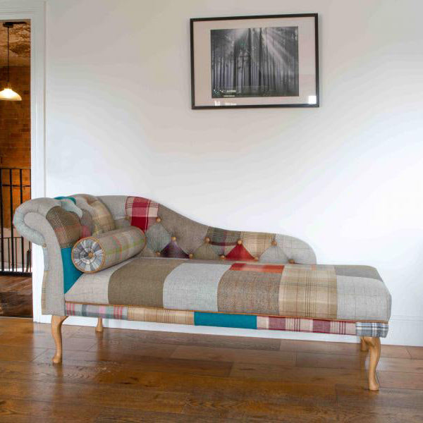 Vintage Sofa Company Chester Chaise Sofa in Patchwork upholstery, with matching bolster cushion, button tufting to the backrest, one scrolled arm and wooden legs