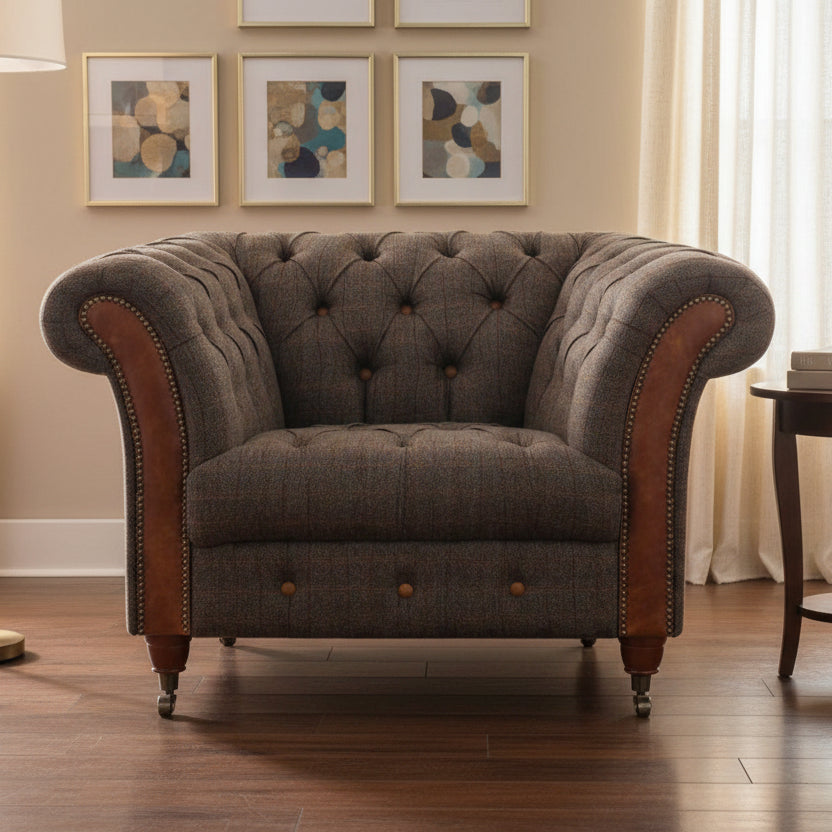 Vintage Sofa Company Chester Club Chair in Moreland Harris Tweed Fabric with tan leather scrolled arms, deep button tufting and a generous seat. It brings heritage texture, comfort and lasting character to a room without feeling overly formal.
