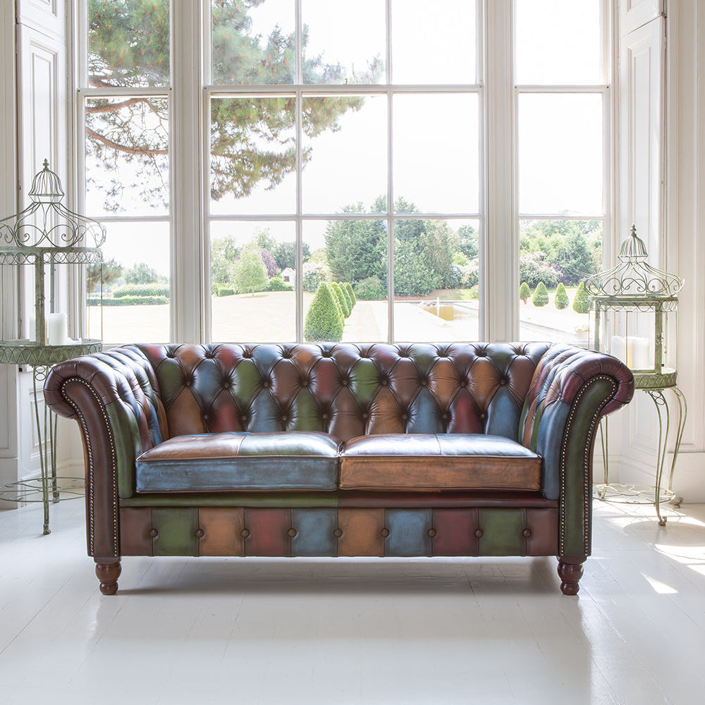 Vintage Sofa Company Chester Croft Rub Off Leather Patchwork 2 Seater Sofa with deep buttoning, brass stud details and turned wood feet