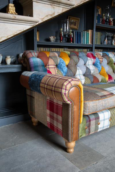 Vintage Sofa Company Dickinson 2 Seat Medium Sofa with Patchwork fabric, scrolled arms with tan leather panels and brass stud detailing