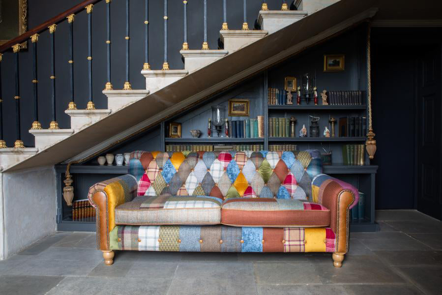 Vintage Sofa Company Dickinson 2 Seat Medium Sofa Upholstered In a mix of Patchwork fabrics with Tan Leather panels and Mid Oak feet