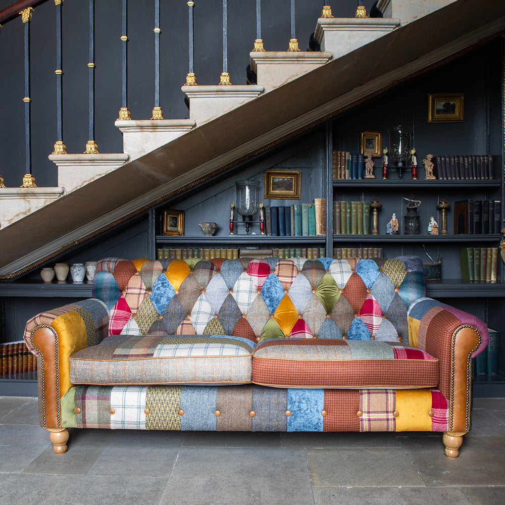 Vintage Sofa Company Dickinson Large 2.5 Seater Sofa is upholstered in a Patchwork mix of tweeds, checks, herringbones and velvets with deep button tufting & Tan Leather accents