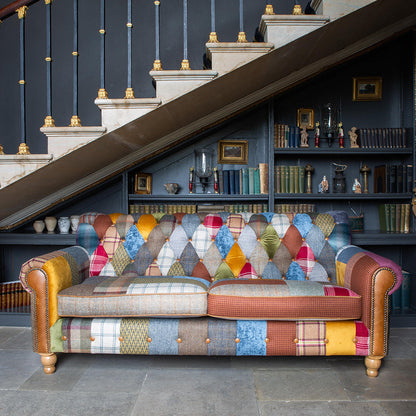 Vintage Sofa Company Dickinson Large 2.5 Seater Sofa is upholstered in a Patchwork mix of tweeds, checks, herringbones and velvets with deep button tufting & Tan Leather accents