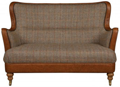 Vintage Sofa Company Ellis 2 Seat Sofa in Hunting Lodge Harris Tweed Fabric with tan leather trim, brass stud detailing and turned wooden legs with front castors
