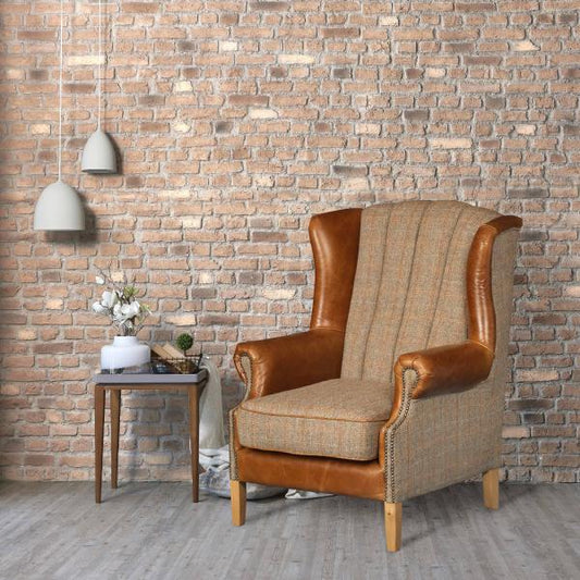 Vintage Sofa Company Fluted Wing Armchair in Hunting Lodge Harris Tweed Fabric and Tan Leather-trimmed wings, with scrolled arms, brass stud detailing and wooden legs