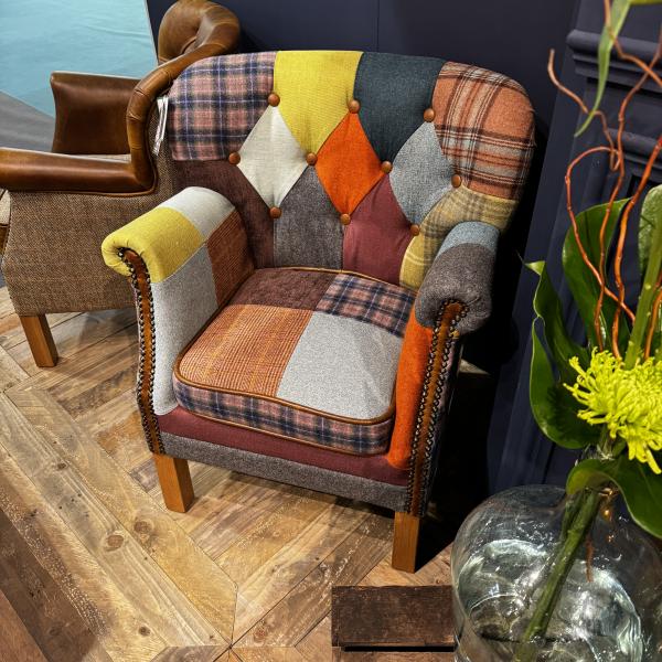 Vintage Sofa Company Governor Armchair Upholstered in Patchwork Fabric with tan leather details, brass studwork and wooden legs