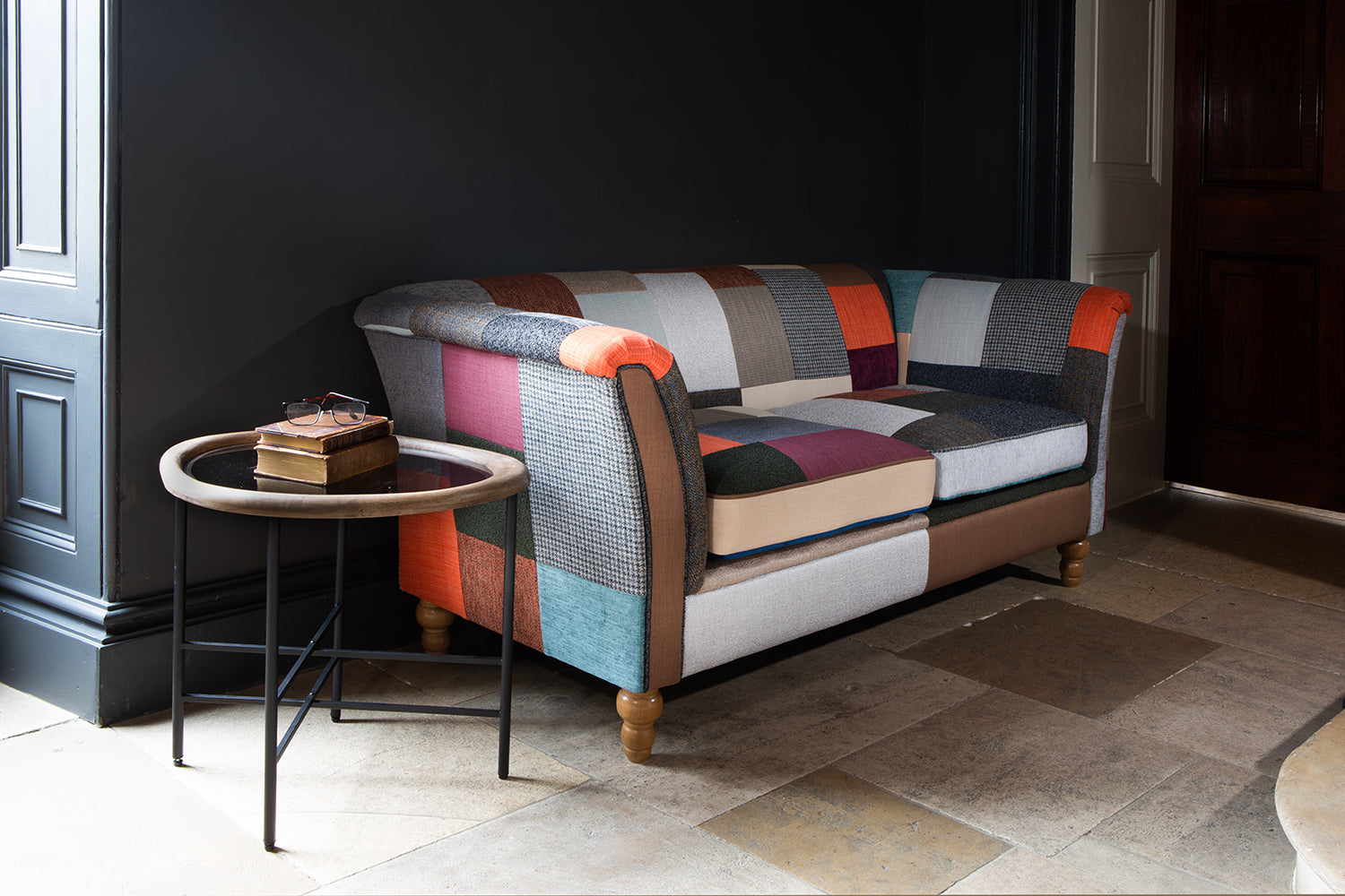 Vintage Sofa Company Granby 2 Seater patchwork Plain Back Sofa features rolled arms, turned wooden feet and generously filled seat cushions