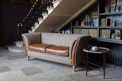 Vintage Sofa Company Granby 2 Seater Plain Back Sofa with Tan Leather seat cushions and panelled arms, and turned wooden legs