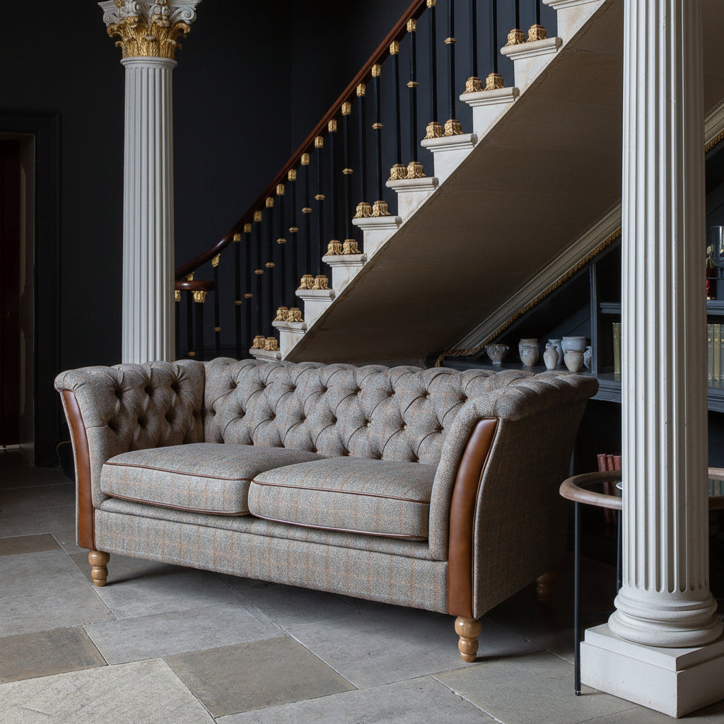 Vintage Sofa Company Granby 2 Seater Sofa in Hunting Lodge fabric with tan leather trim, deep button tufting and turned wooden legs