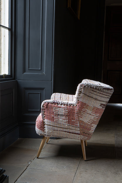 Vintage Sofa Company Hansi Accent Chair with textured woven upholstery, softly curved arms and tapered wooden legs give the Hansi Chair a warmer, more individual feel than a simpler occasional chair. 
