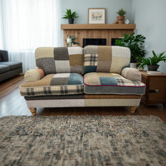 Vintage Sofa Company Hawksworth 2 Seater Sofa upholstered in a patchwork fabric with a mix of tweeds, velvets and checks to create a one off piece. Plush cushions, rounded armrests and turned wooden legs 