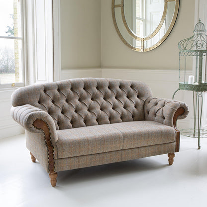 Vintage Sofa Company Haworth 2 Seater Sofa in Hunting Lodge neutral toned fabric, features deep button tufting to the back and arms, tan leather accents and medium oak wood legs