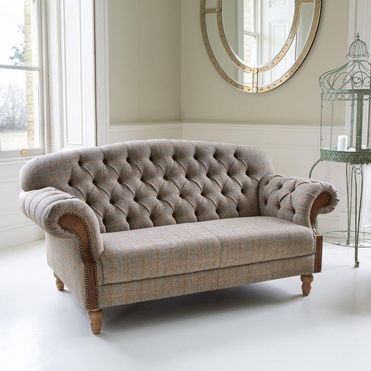 Vintage Sofa Company Haworth 2 Seater Sofa in Hunting Lodge neutral toned fabric, features deep button tufting to the back and arms, tan leather accents and medium oak wood legs