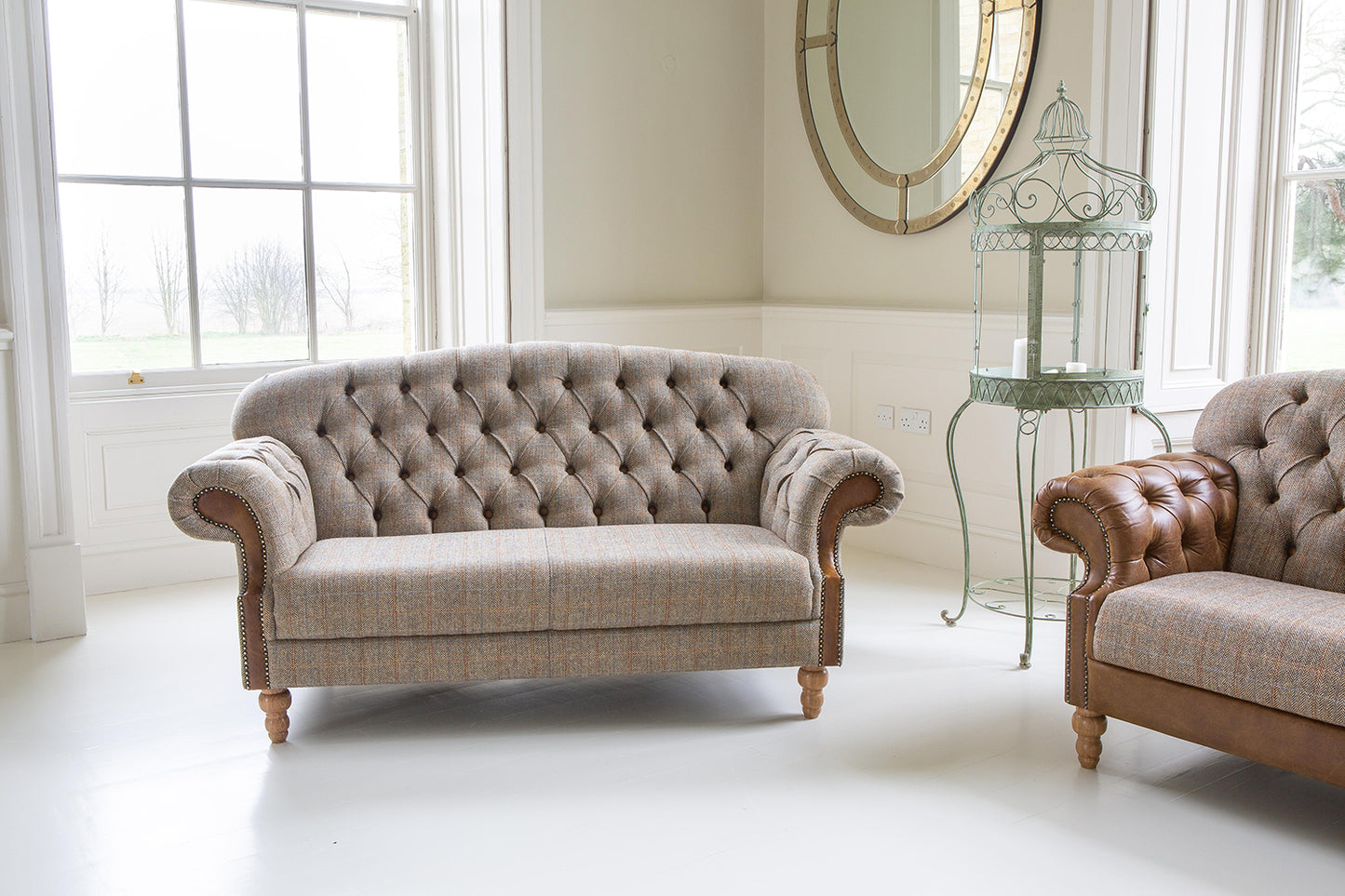 Vintage Sofa Company Haworth 2 Seater Sofa in Hunting Lodge tweed fabric with tan leather panels on the scrolled arms and brass stud detailing.