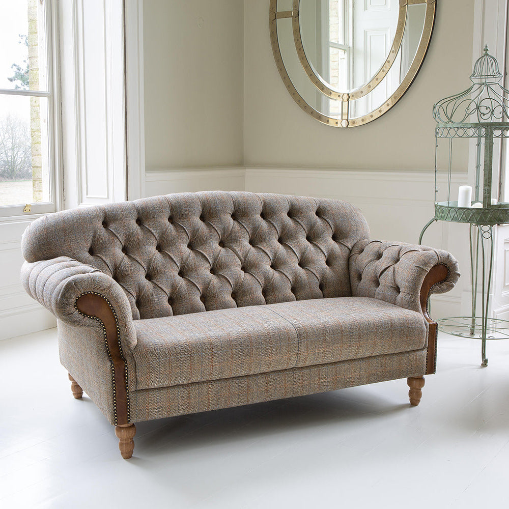Vintage Sofa Company Haworth 3 Seater Sofa features buttoned back detailing, rolled arms and Hunting Lodge tweed fabric, fished with medium oak legs, it brings traditional character and comfortable everyday seating to larger living spaces