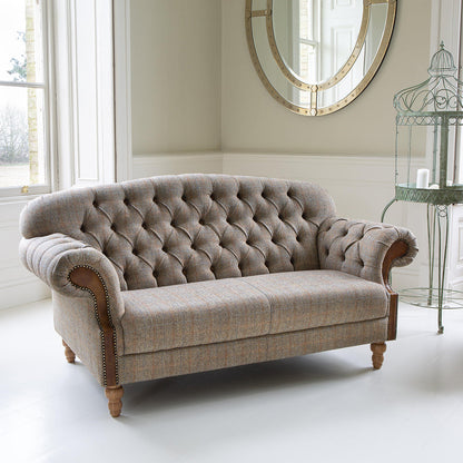 Vintage Sofa Company Haworth 3 Seater Sofa features buttoned back detailing, rolled arms and Hunting Lodge tweed fabric, fished with medium oak legs, it brings traditional character and comfortable everyday seating to larger living spaces