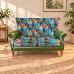 Vintage Sofa Company Hexham two seater sofa in Kingfisher fabric and Bottle Green leather shown complete in a living room