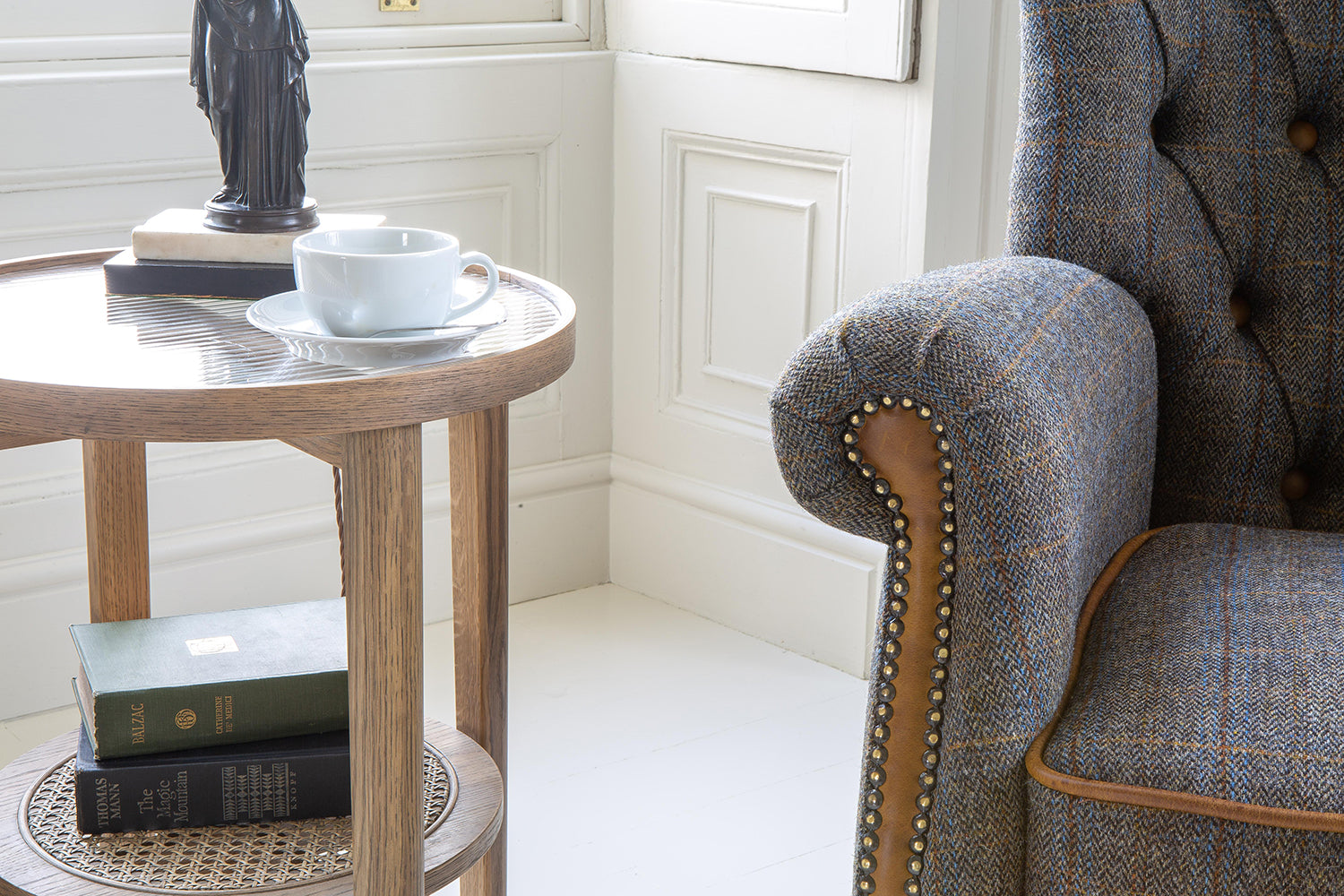 Vintage Sofa Company Hexham Chair in Moreland Harris Tweed fabric with tan leather trim, brass stud detailing and button tufting to the high backrest 