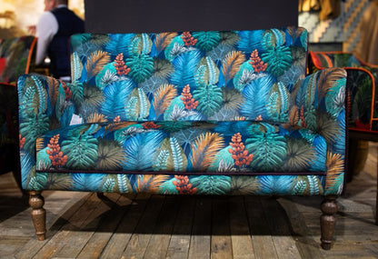 Vintage Sofa Company Howden Compact 2 Seater Sofa in Tropical Leaf Kingfisher upholstery, with turned wooden legs