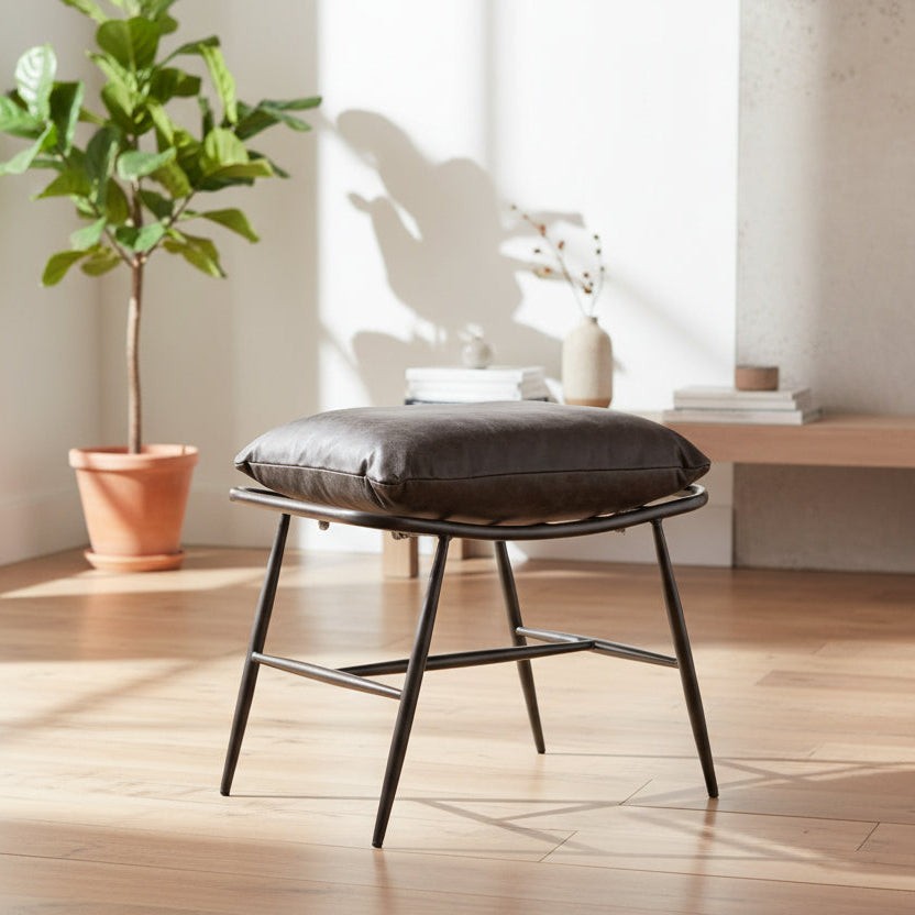 Vintage Sofa Company Huntingdon Stool is made from a sleek powder coated black metal frame and features a premium brown leather padded cushion 