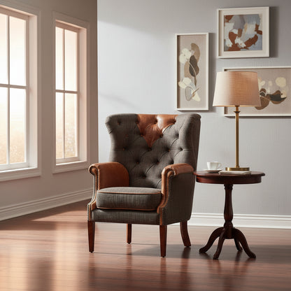 Vintage Sofa Company Kensington Wing Chair in Moreland Harris Tweed Charcoal coloured fabric with tan leather accents. Dark wooden legs and brass stud detailing to the scrolled arms