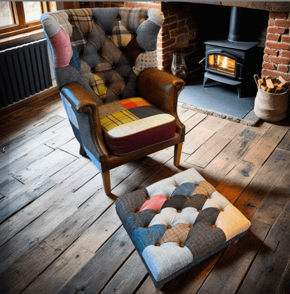 Vintage Sofa Company Kensington Wingback Armchair in Patchwork upholstery with tan leather arms, brass stud detailing and wooden legs. Footstool sold separately