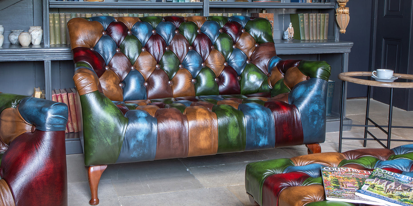 Vintage Sofa Company Litton Rub-Off Leather Patchwork 2 Seater Sofa with deep button tufting design and shaped wooden legs 