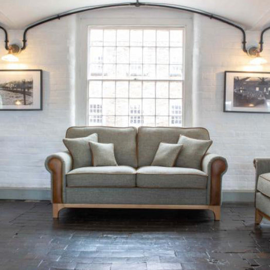 Vintage Sofa Company Lowther 3 Seat Sofa upholstered in Lowland Thistle Harris Tweed Fabric with tan leather accents, scatter cushions and light wooden base