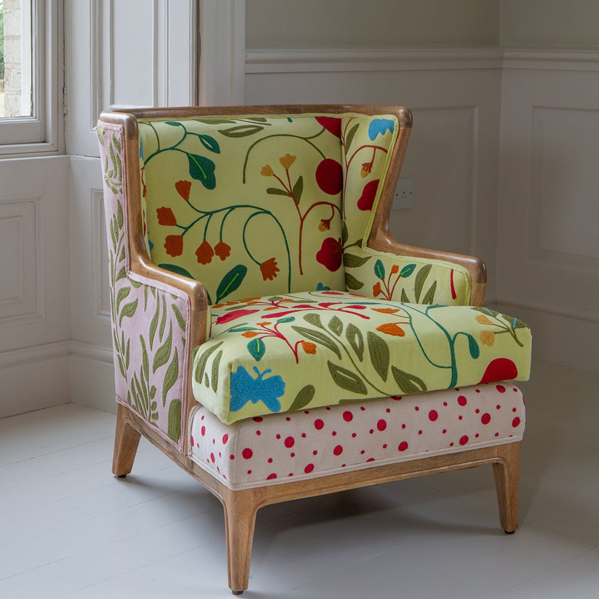 Vintage Sofa Company Morbi Chair features a solid wood exposed frame and is upholstery with a variety of fabrics and designs including florals and polka dots