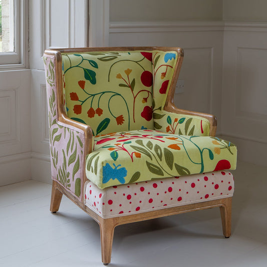 Vintage Sofa Company Morbi Chair features a solid wood exposed frame and is upholstery with a variety of fabrics and designs including florals and polka dots