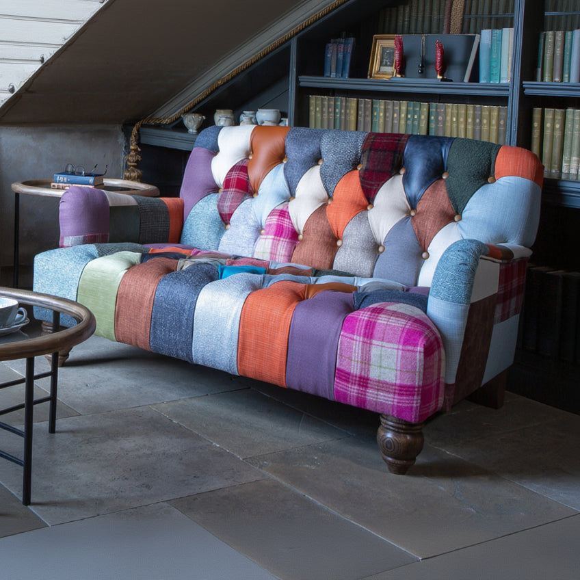 Vintage Sofa Company Morgan 2 Seater Sofa Upholstered in a mix of Leather & Wool Patchwork panels, with deep button tufting to the back and seat, and turned wooden feet