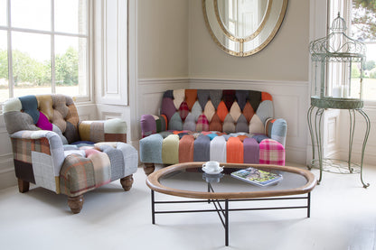 Vintage Sofa Company Morgan Armchair upholstered in a mix of Leather and Wool Patchwork panels with deep button tufting, gently rolled arms and chunky wooden legs