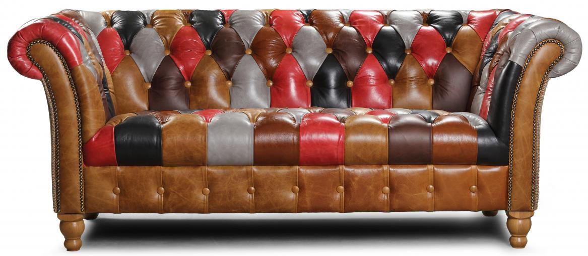 The Vintage Sofa Company Prestbury Patchwork 2 Seater Sofa is a Chesterfield inspired piece with iconic deep button tufting and rolled arms with stud detailing in a vibrant patchwork leather