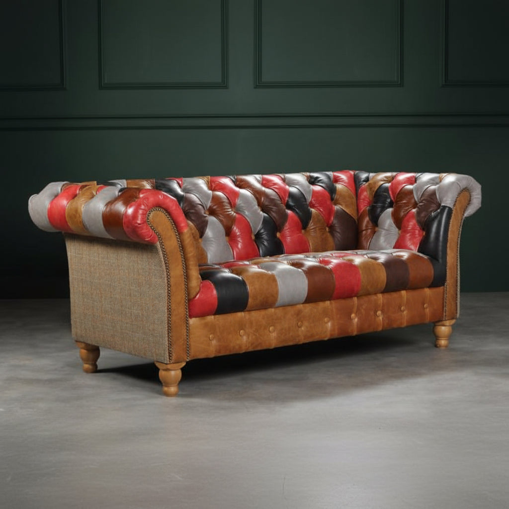 The Vintage Sofa Company Prestbury Patchwork 2 Seat Sofa is a multi coloured, Chesterfield inspired piece with classic diamond quilting design, rolled arms with stud detailing and turned wooden legs