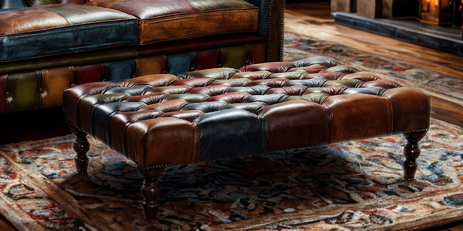 Vintage Sofa Company Rub Off Leather Patchwork Banquette Footstool with button tufted top, turned dark wood legs and brass stud detailing