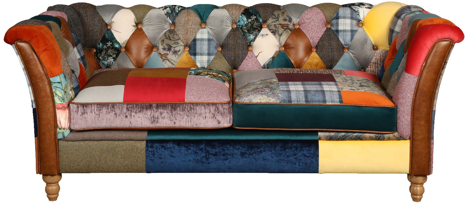 Vintage Sofa Company Rutland 2 Seat Sofa in Patchwork Fabric with Tan Leather accents, deep button tufting and turned wooden legs